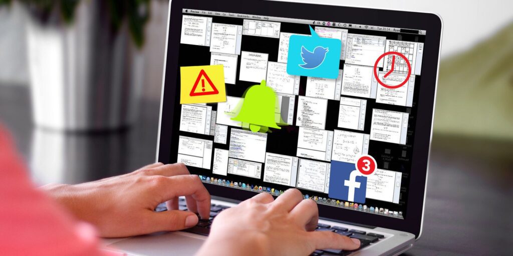 a laptop with many notes and programs open and several notifications and timers popping up