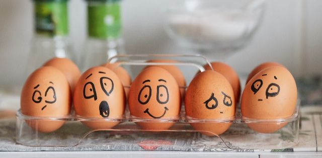 eggs with drawn faces showing emotions